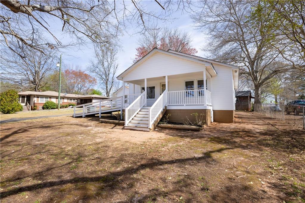 204 Old Salem Road Seneca, SC 29672 - Photo 3 of 28 This charming home offers a welcoming facade with a covered porch and accessibility features.