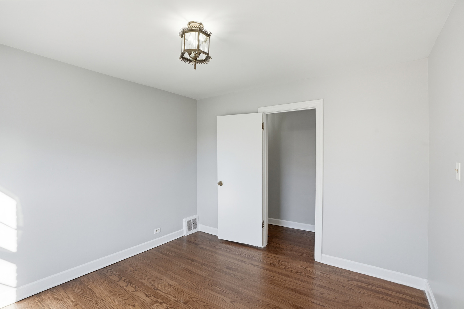6550 North Ridge Boulevard, Unit 2 Chicago, IL 60626 - Photo 11 of 32 a view of a storage & utility room with wooden floor