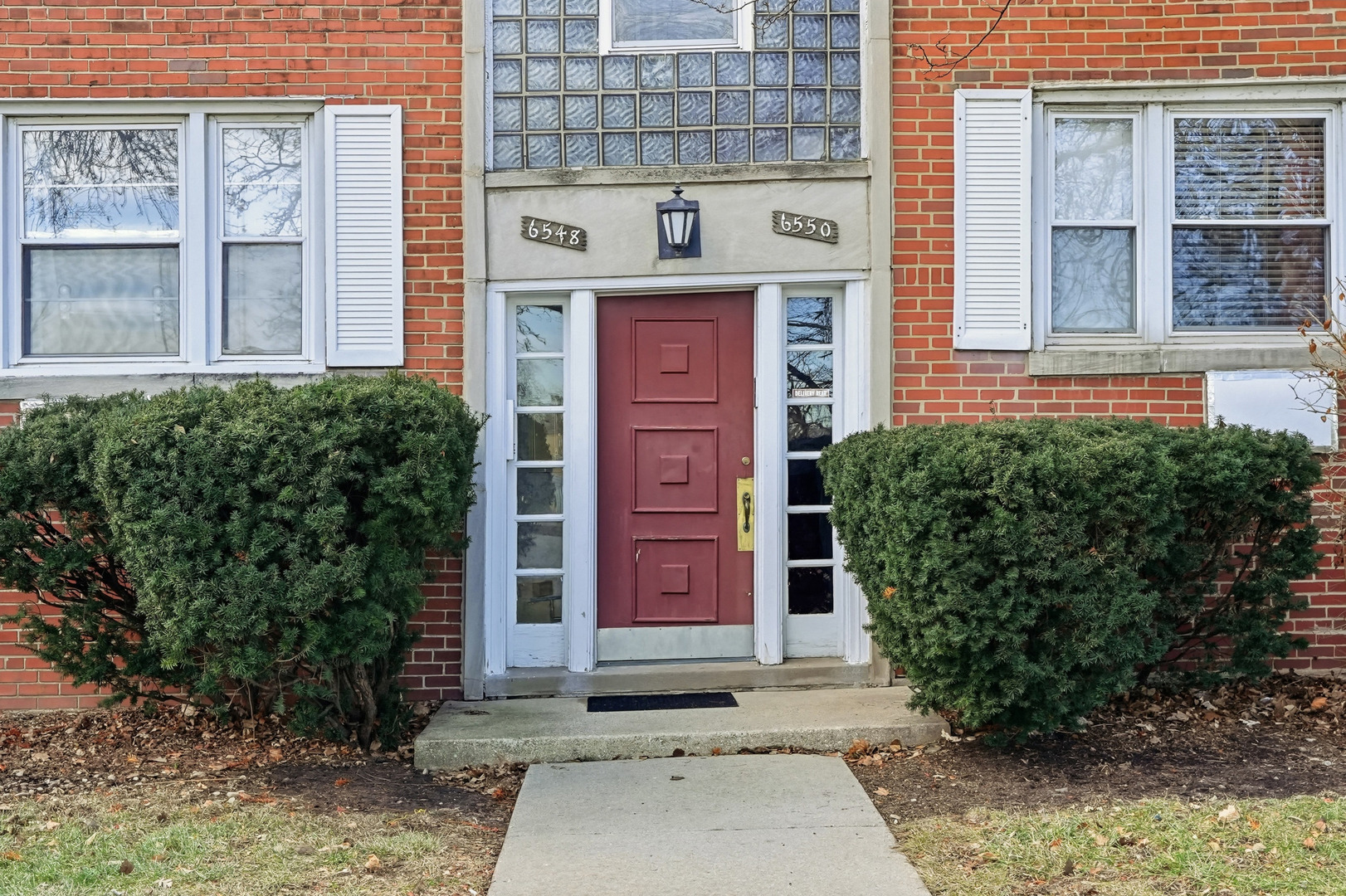 6550 North Ridge Boulevard, Unit 2 Chicago, IL 60626 - Photo 32 of 32 front view of a brick house with a yard