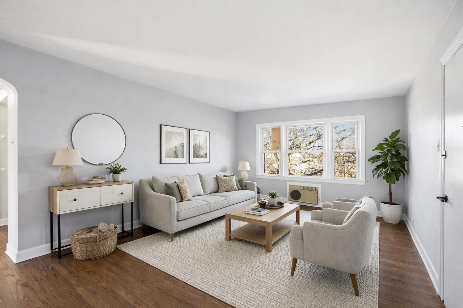 6550 North Ridge Boulevard, Unit 2 Chicago, IL 60626 - Photo 7 of 32 a living room with furniture a fireplace and a potted plant