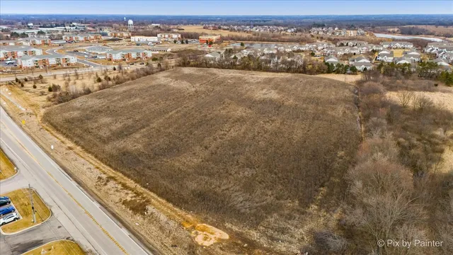 an aerial view of residential building and ocean view