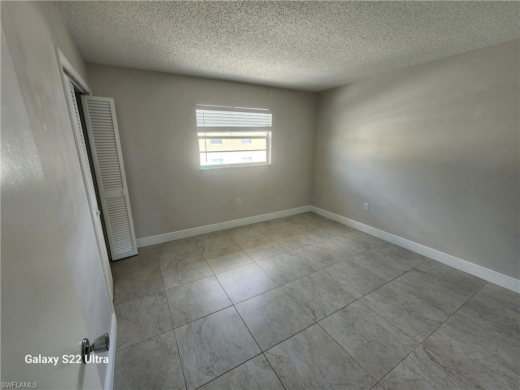 3325 Airport Road North, Unit N8 Naples, FL 34105 - Photo 15 of 22 an empty room with windows