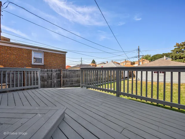 a balcony with wooden floor