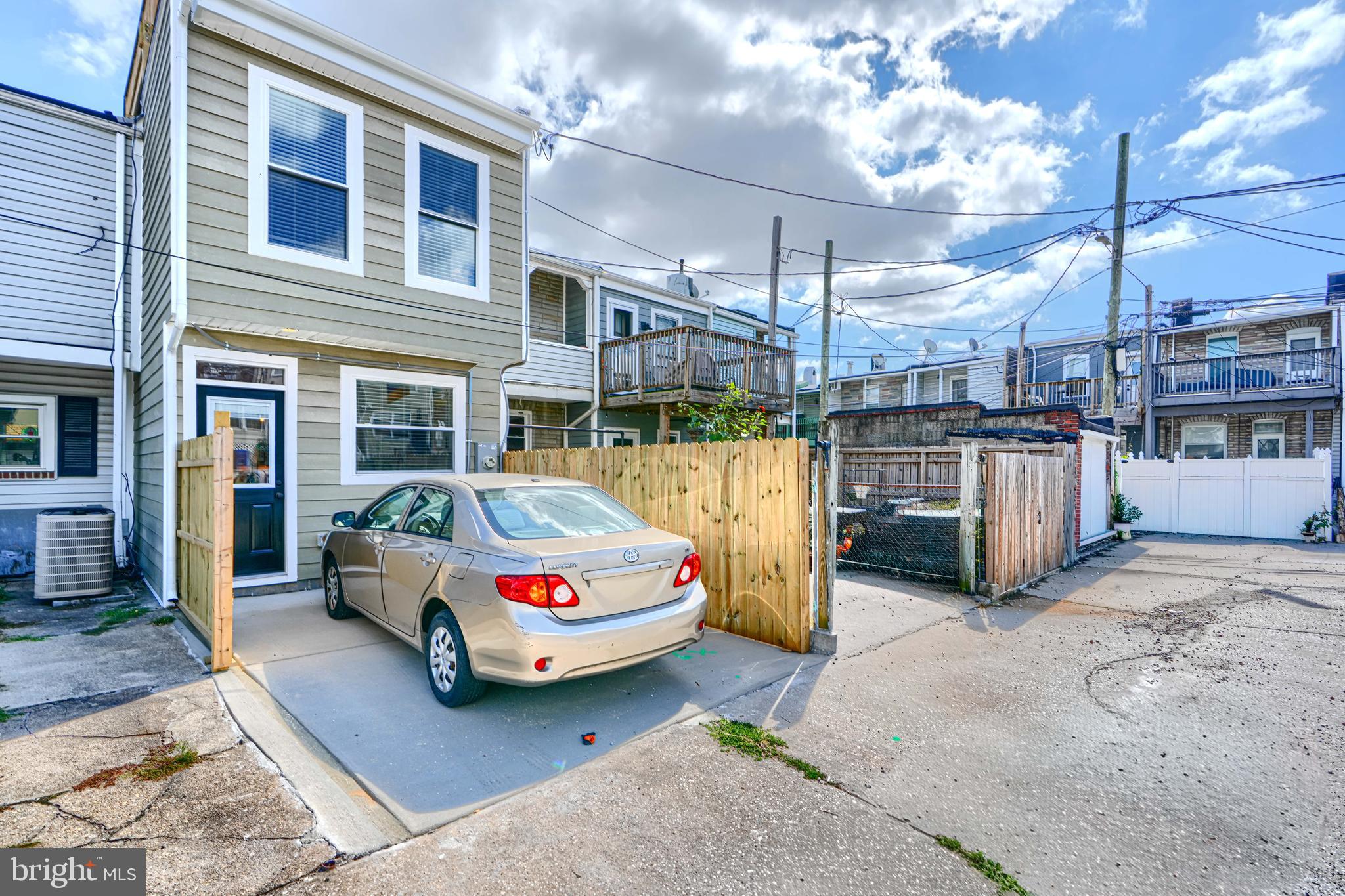 814 Grundy Street Baltimore, MD 21224 - Photo 14 of 31 a car parked in front of building