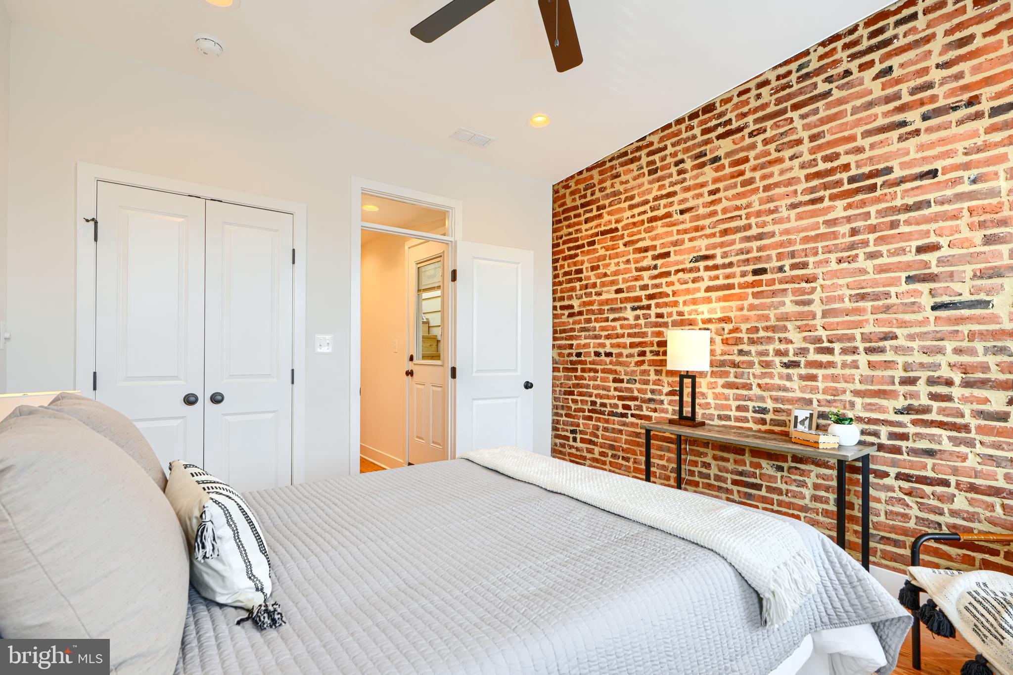 814 Grundy Street Baltimore, MD 21224 - Photo 20 of 31 a bedroom with a bed and a painting on the wall