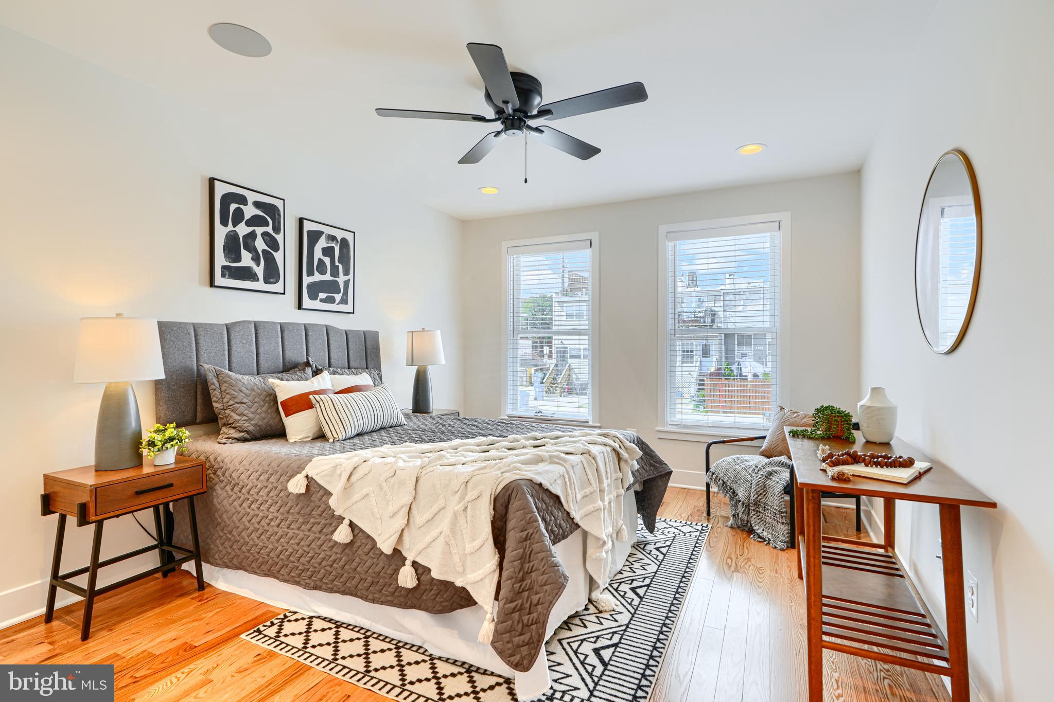 814 Grundy Street Baltimore, MD 21224 - Photo 23 of 31 a bedroom with a bed a couch and a chandelier