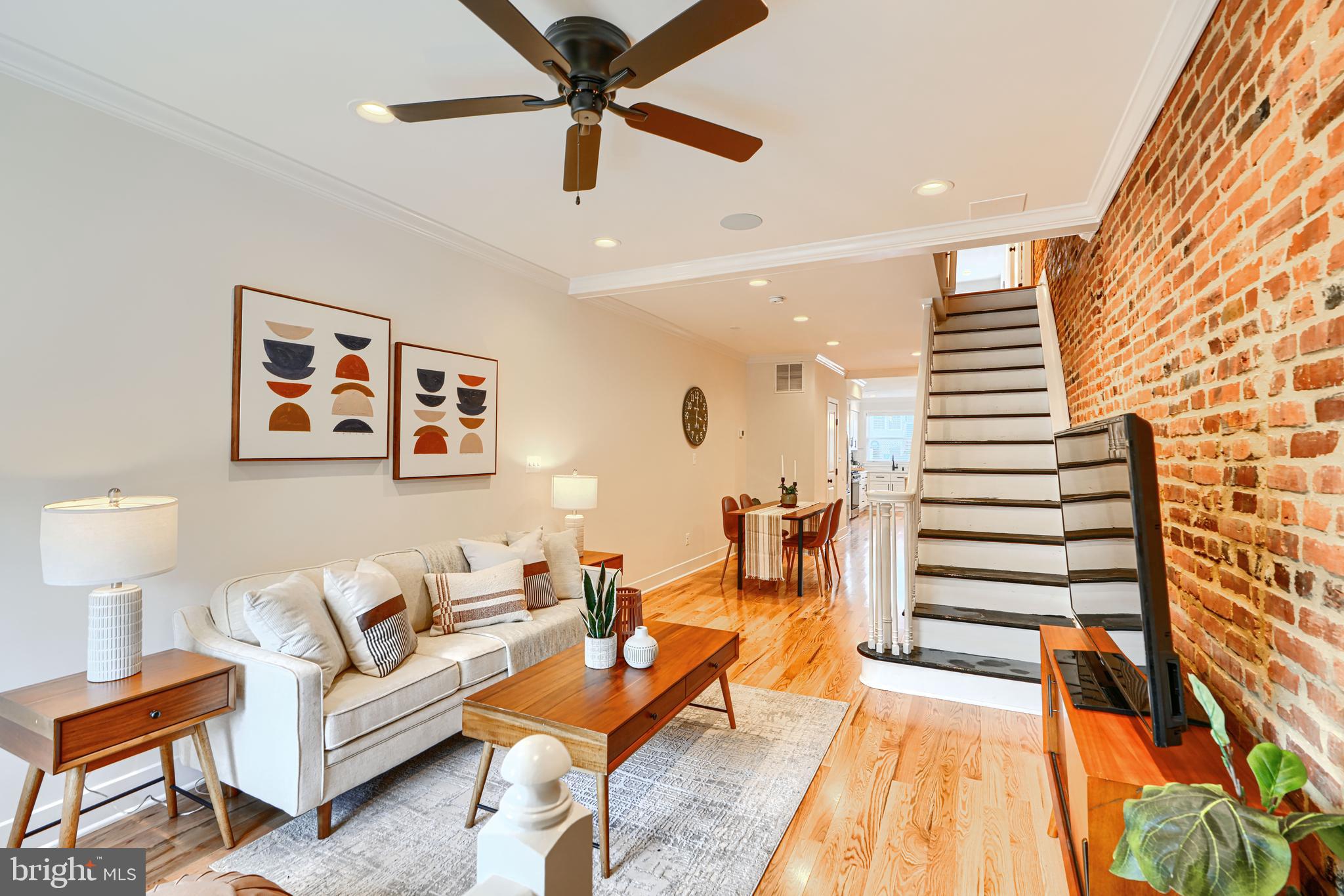 814 Grundy Street Baltimore, MD 21224 - Photo 3 of 31 a living room with furniture and a wooden floor