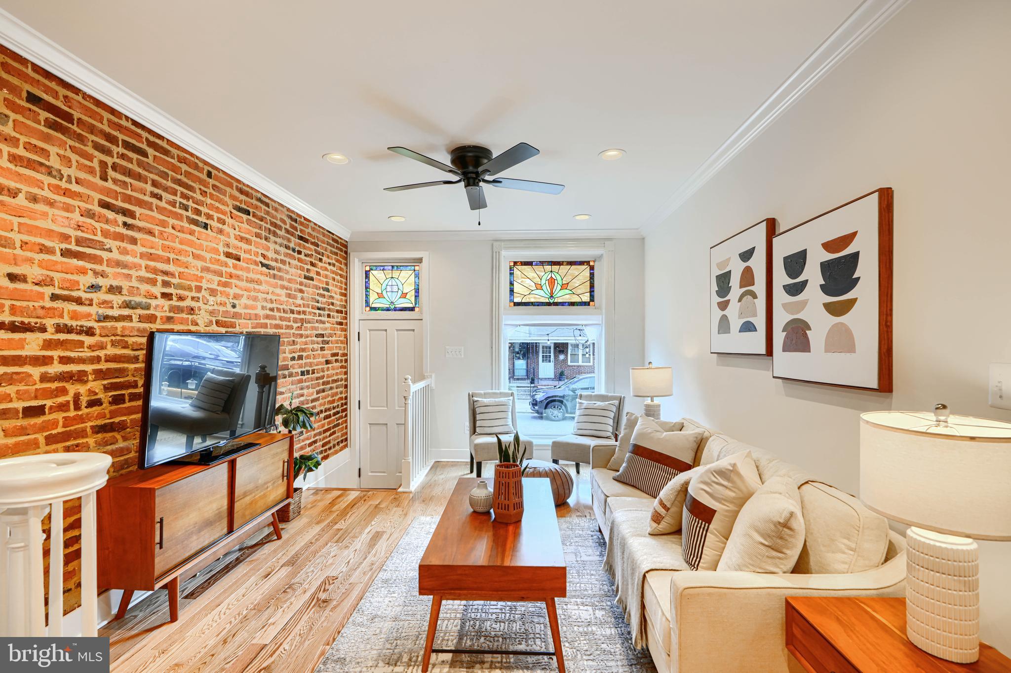 814 Grundy Street Baltimore, MD 21224 - Photo 5 of 31 a living room with furniture and a flat screen tv