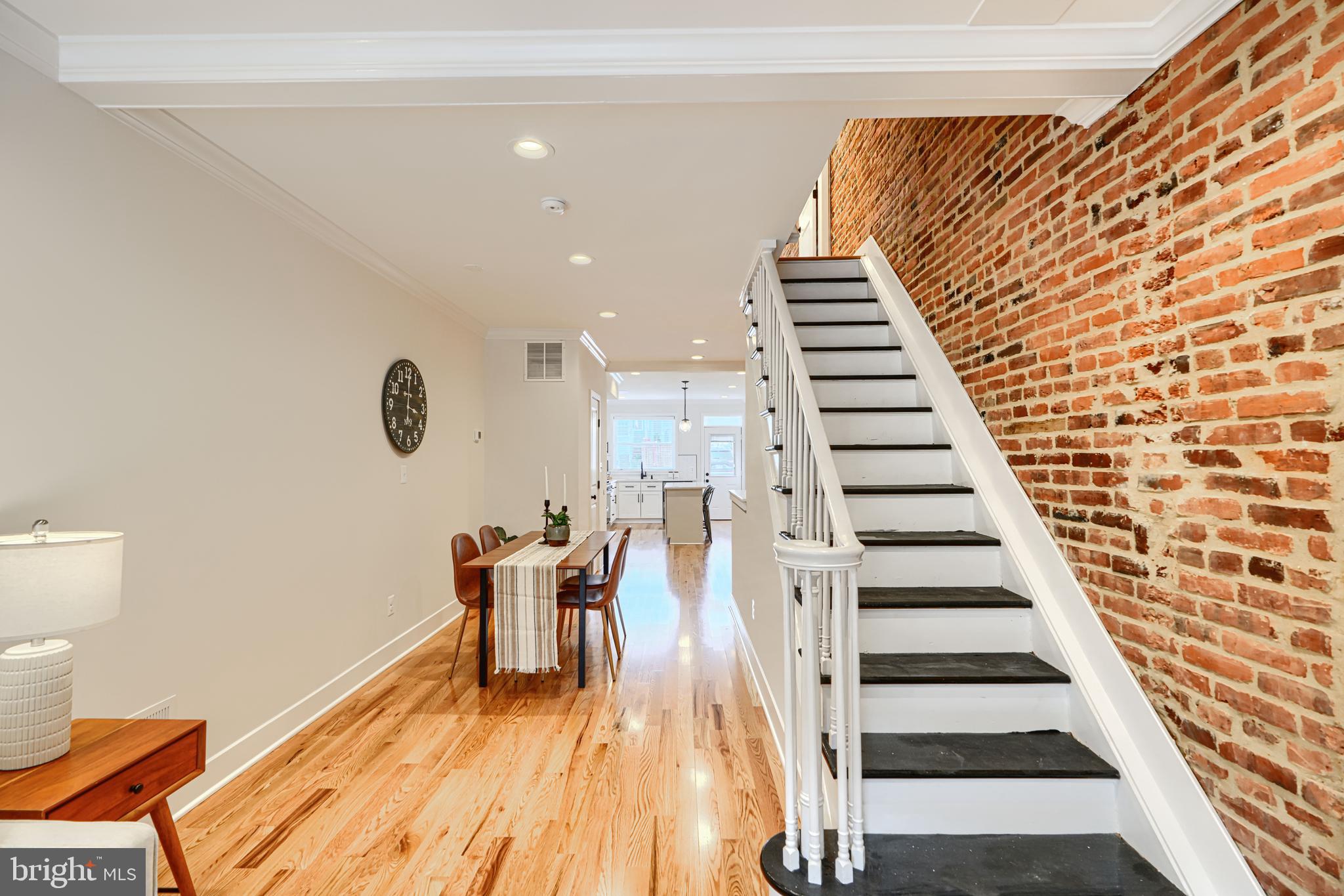 814 Grundy Street Baltimore, MD 21224 - Photo 7 of 31 a view of entryway and hall with wooden floor