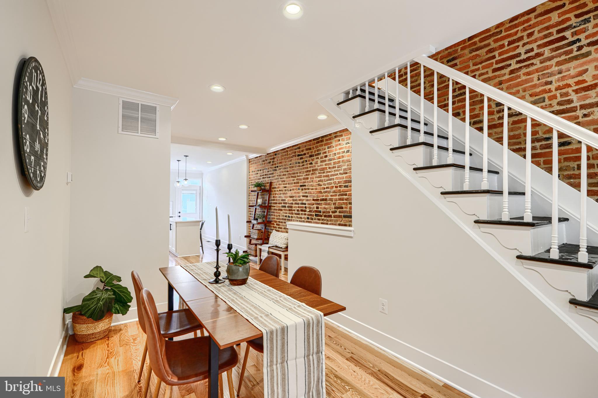 814 Grundy Street Baltimore, MD 21224 - Photo 8 of 31 a view of entryway and hall with wooden floor