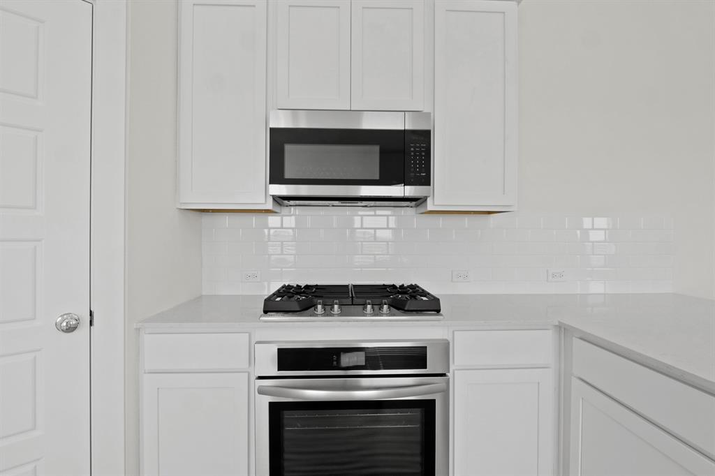 8208 Coastal Lane Pilot Point, TX 76258 - Photo 8 of 17 Kitchen in the Pecan II home plan by Trophy Signature Homes – REPRESENTATIVE PHOTO