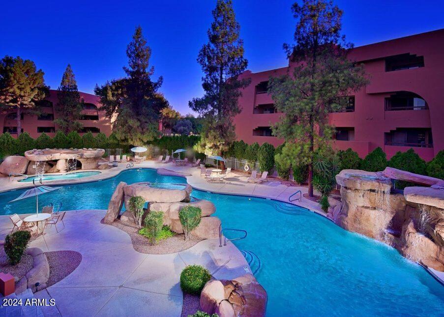 4303 East Cactus Road, Unit 235 Phoenix, AZ 85032 - Photo 27 of 29 a view of a swimming pool with a patio
