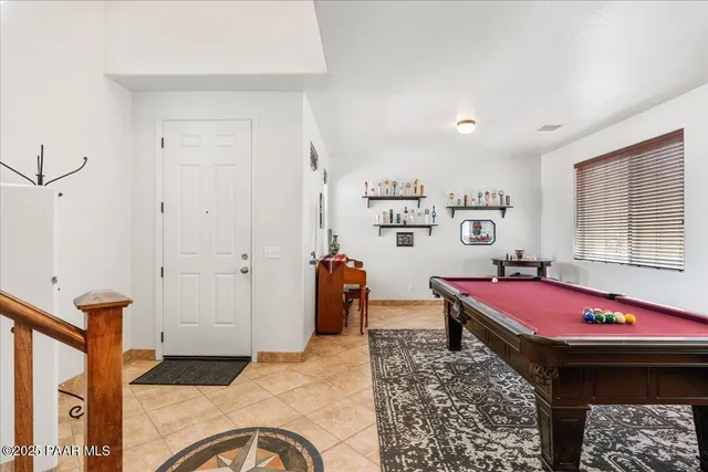 a living room with a couch and dresser