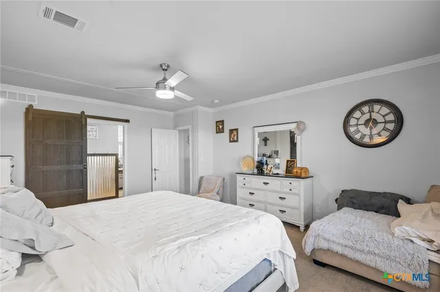 a bedroom with two beds and a large mirror