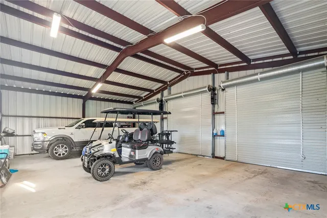 a view of a garage with parked cars