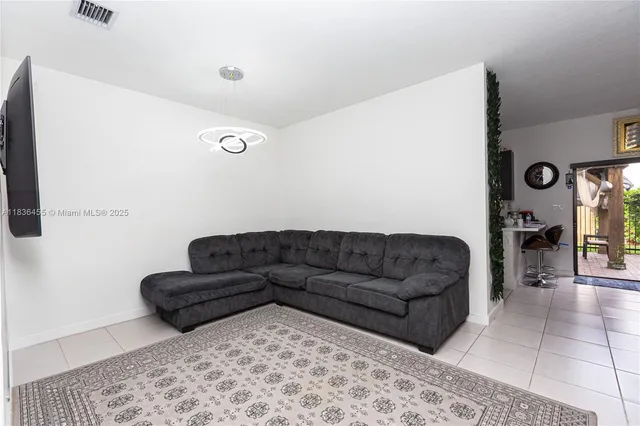 a living room with furniture and a couch