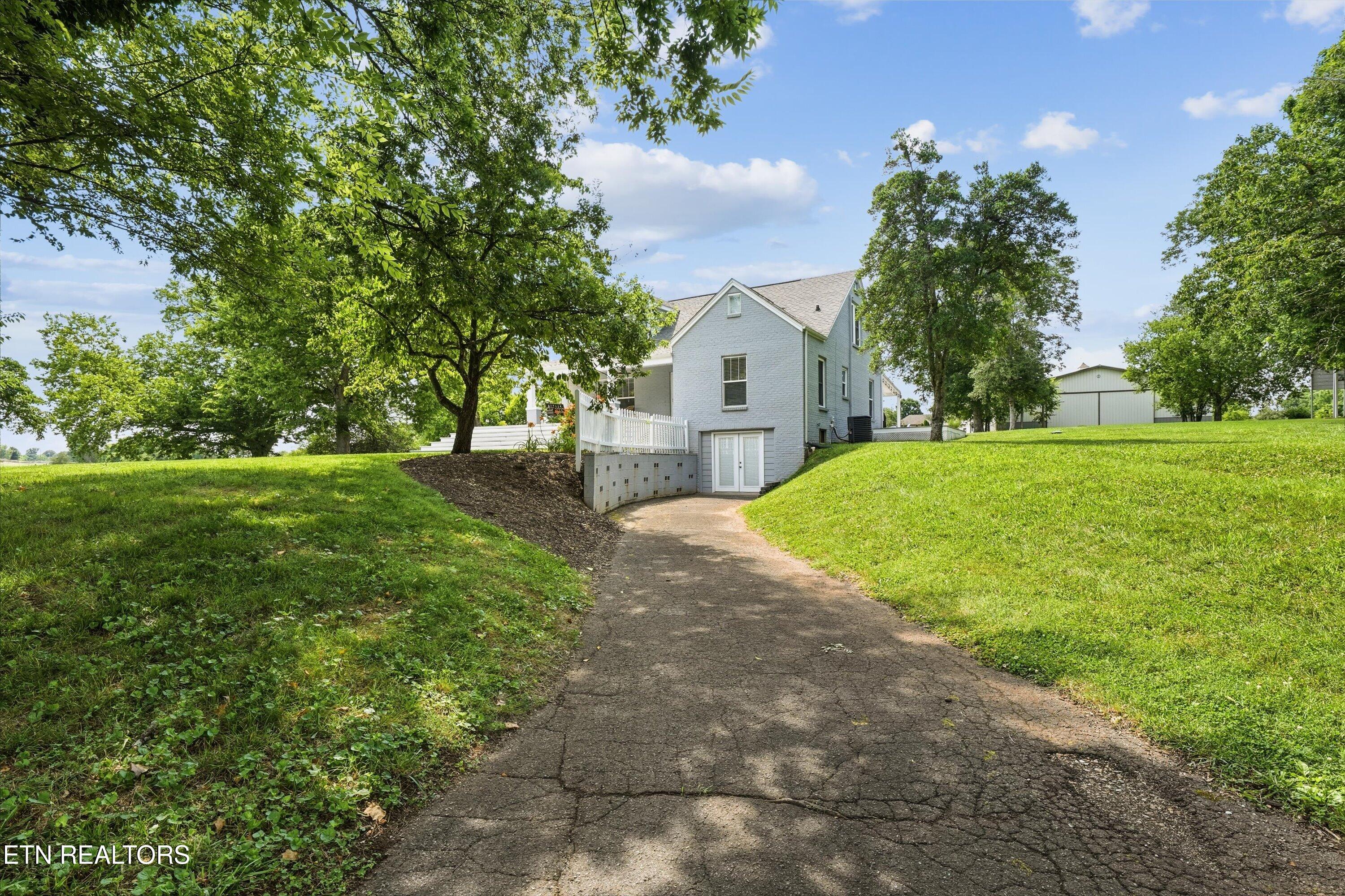 930 Gregg Road Friendsville, TN 37737 - Photo 42 of 48 Basement Entry/Second Driveway
