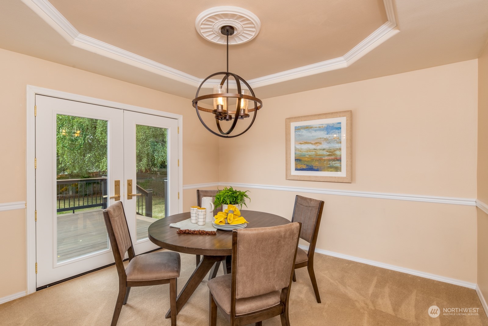 2415 Viewcrest Avenue Everett, WA 98203 - Photo 17 of 37 a view of a dining room with furniture a chandelier and wooden floor