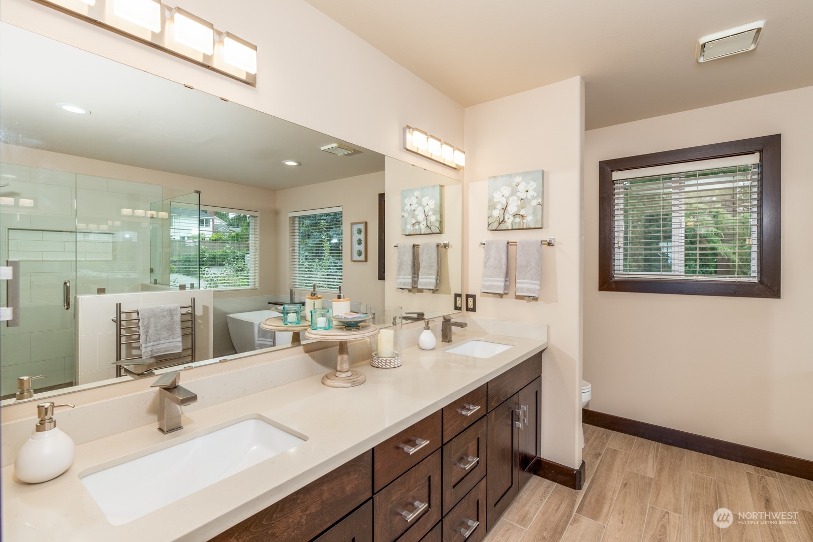 2415 Viewcrest Avenue Everett, WA 98203 - Photo 27 of 37 a bathroom with double vanity sinks a large mirror and a shower