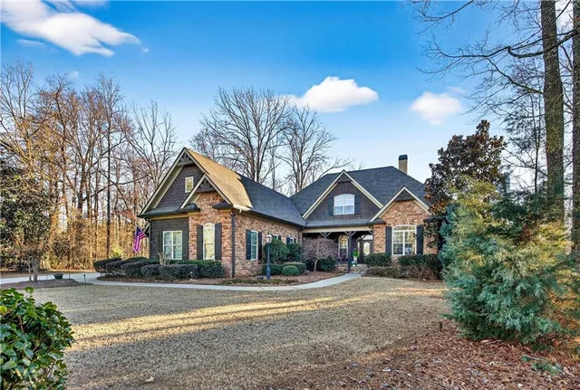 a view of a dining room with furniture wooden floor and chandelier