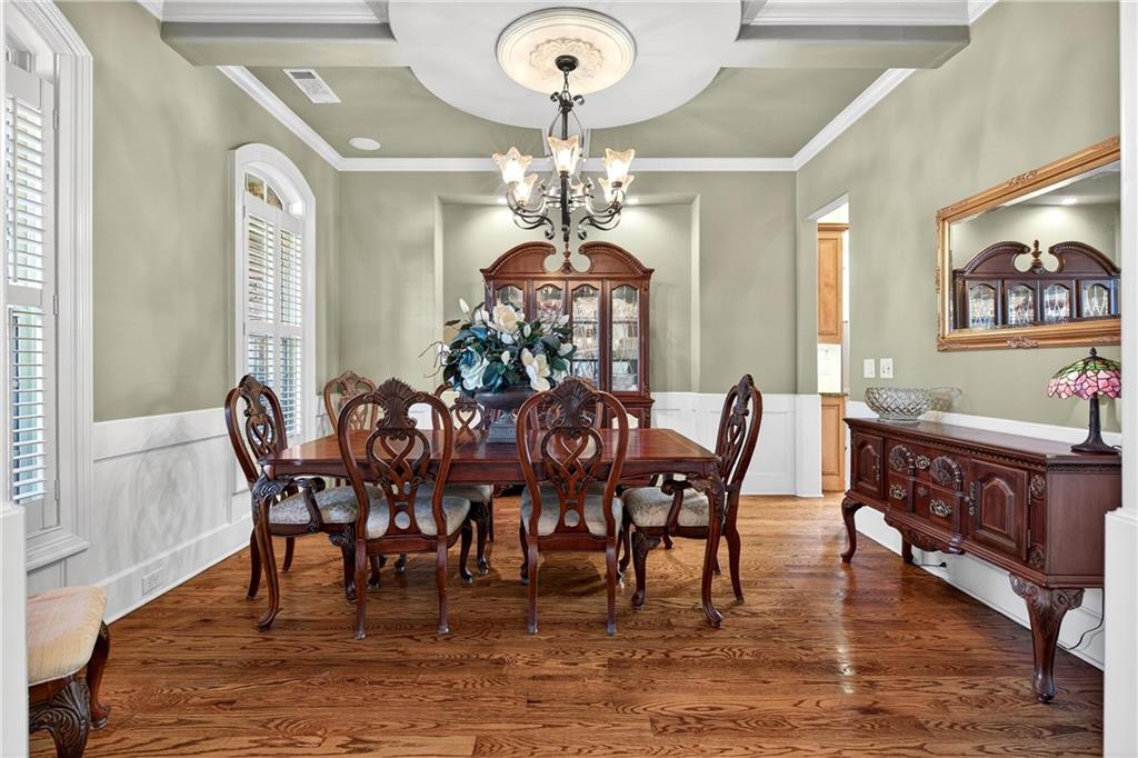 18 Willow Place Newnan, GA 30265 - Photo 18 of 130 a view of a dining room with furniture a chandelier and wooden floor