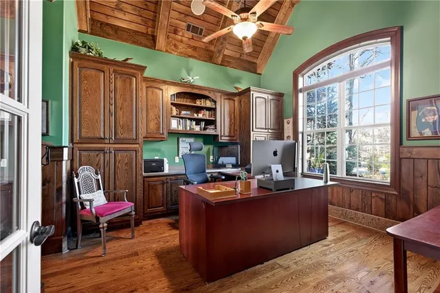 a bathroom with a toilet a sink and a mirror