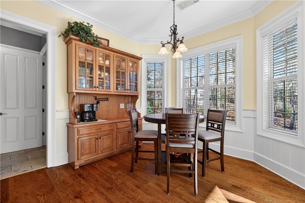 18 Willow Place Newnan, GA 30265 - Photo 44 of 130 a view of a dining room with furniture wooden floor and chandelier