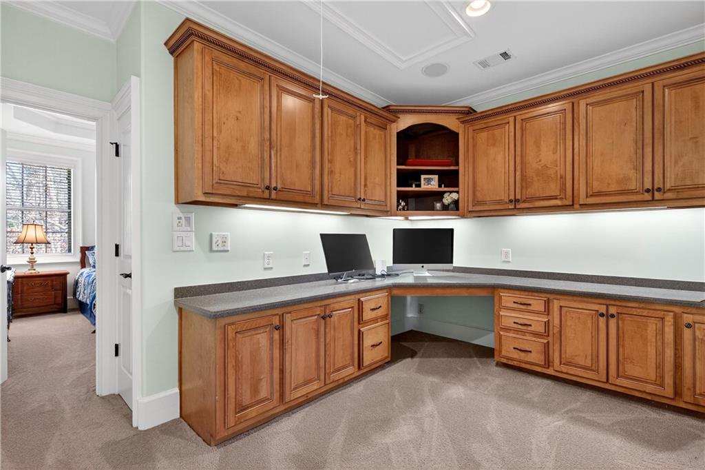18 Willow Place Newnan, GA 30265 - Photo 63 of 130 a kitchen with stainless steel appliances granite countertop a stove sink and cabinets