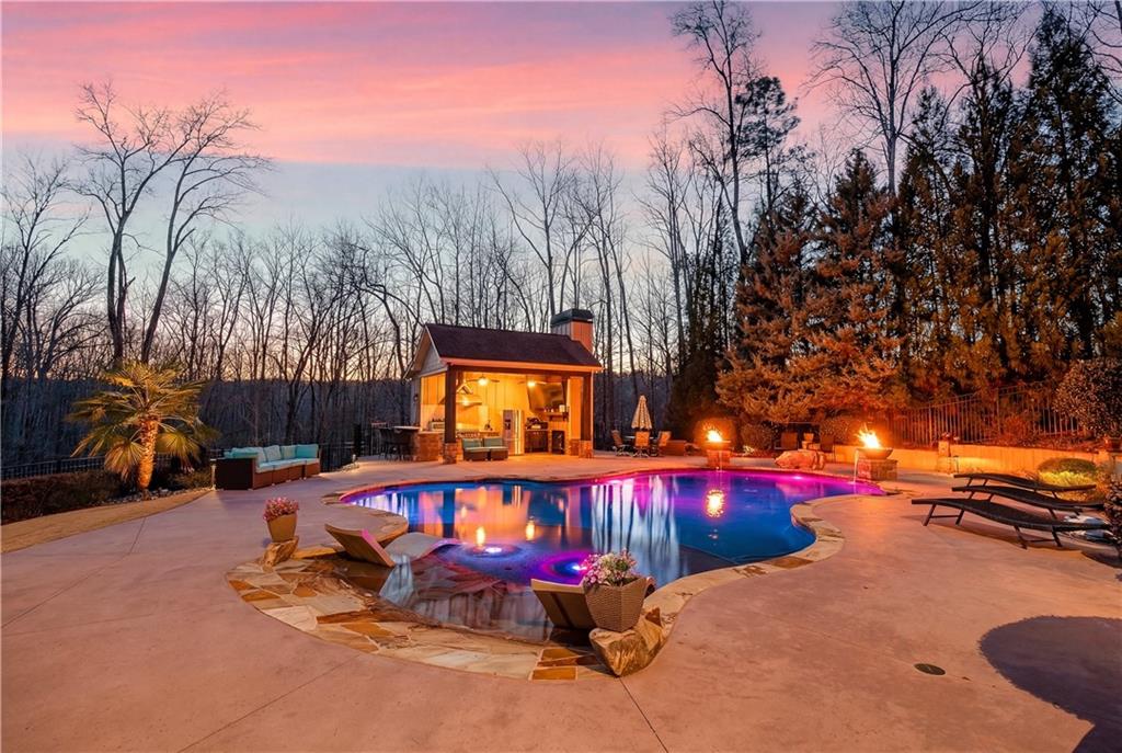 18 Willow Place Newnan, GA 30265 - Photo 7 of 130 a view of a swimming pool with an outdoor space and seating area