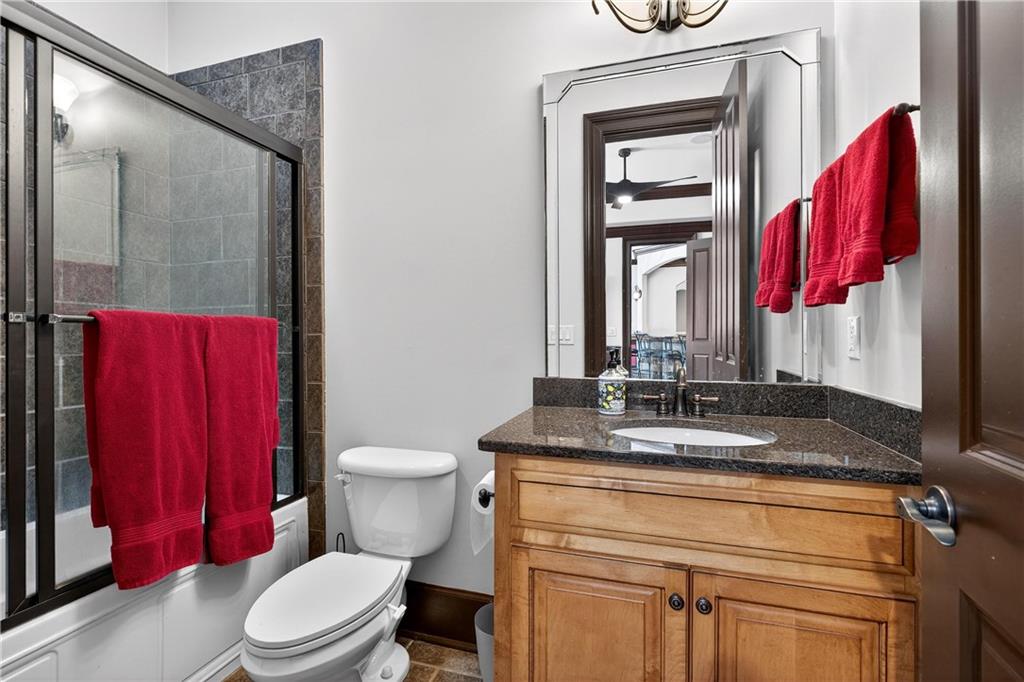 18 Willow Place Newnan, GA 30265 - Photo 85 of 130 a bathroom with a toilet a sink and a mirror