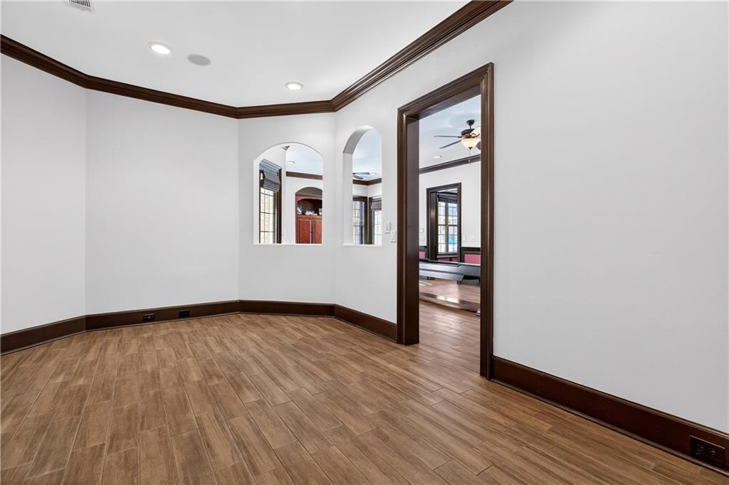18 Willow Place Newnan, GA 30265 - Photo 93 of 130 a view of an empty room with wooden floor and a window