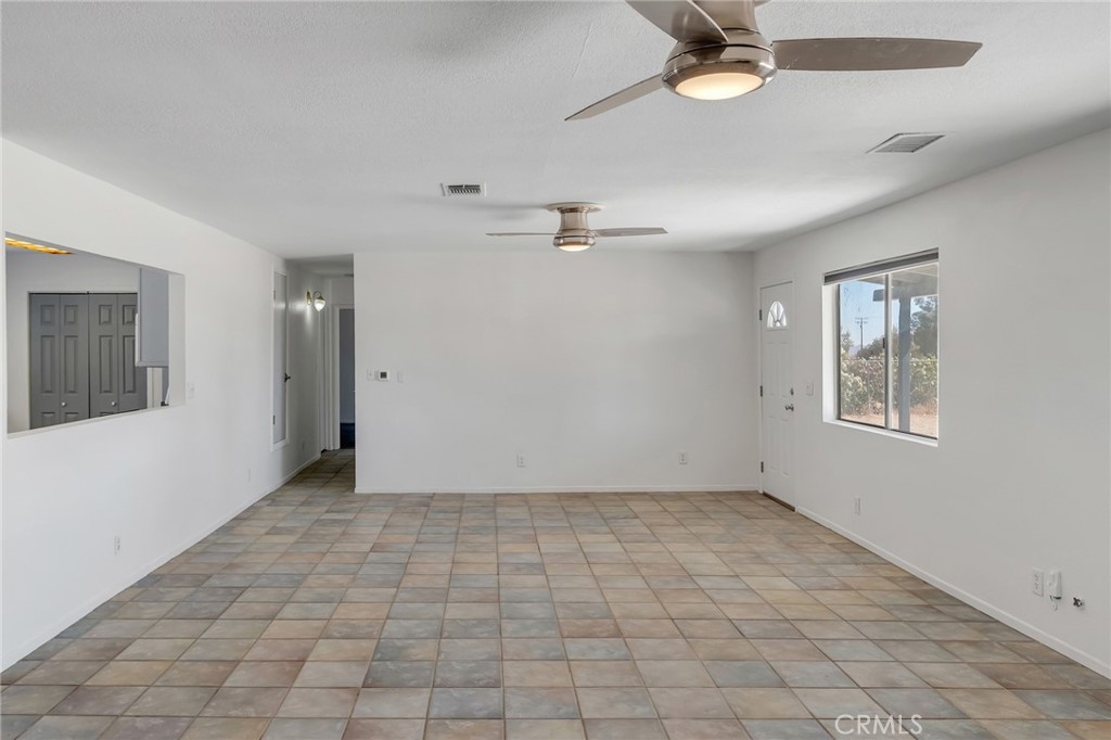 12736 Oasis Road Pinon Hills, CA 92372 - Photo 8 of 33 a view of an empty room with a window