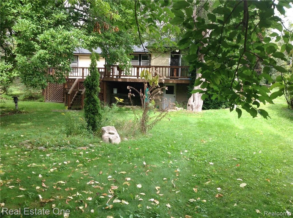 6337 Maybee Road Clarkston, MI 48346 - Photo 8 of 59 Backyard View Of Deck & Home.