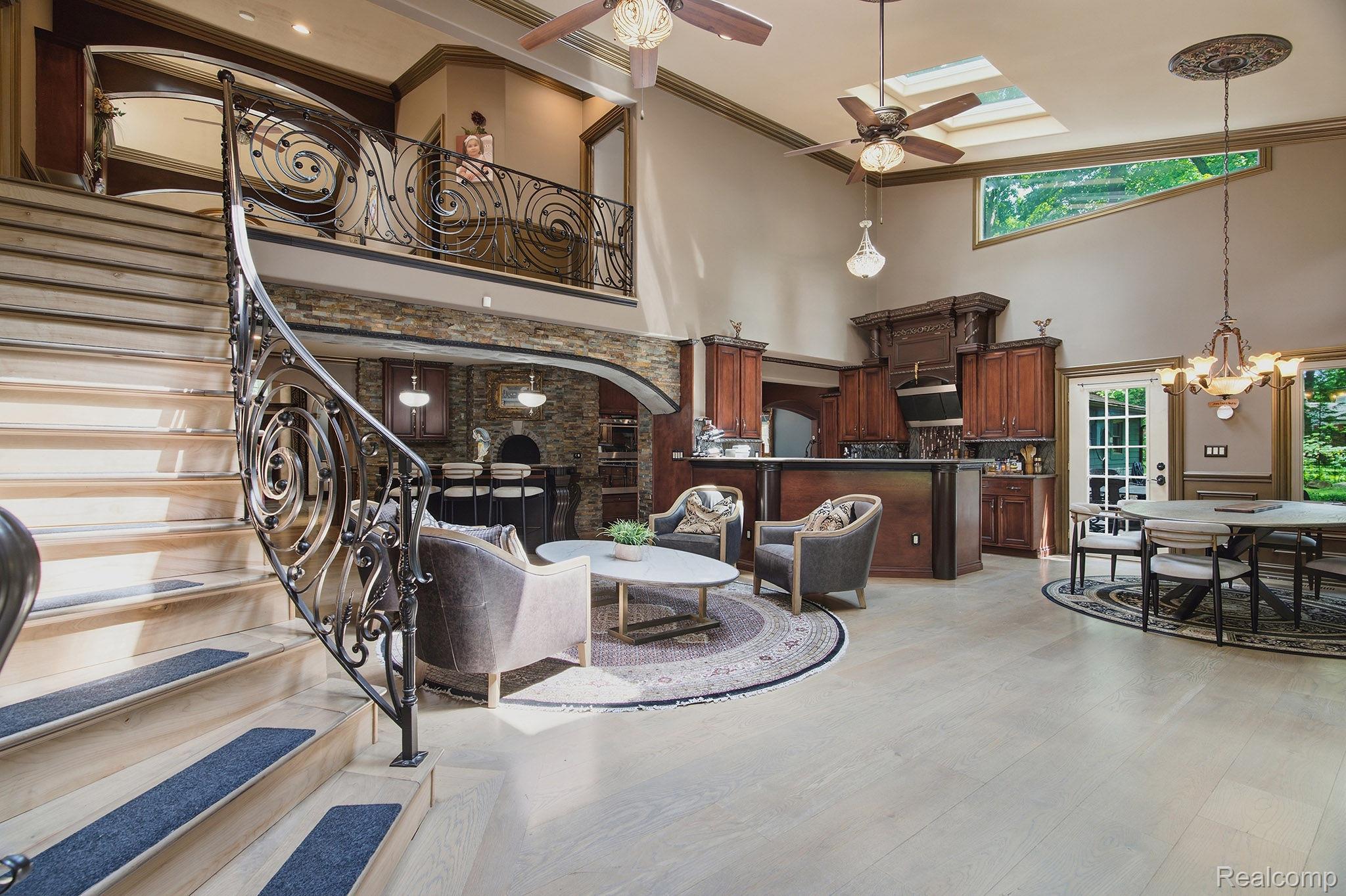 1258 Priscilla Lane Rochester, MI 48309 - Photo 30 of 56 Grand foyer with a custom wrought iron staircase and light wood-finish flooring