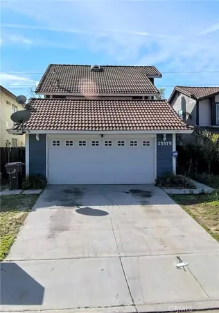 a front view of a house with a garage