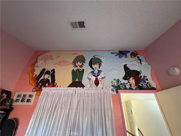 a bedroom with bed and a window