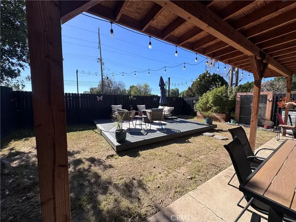 a view of swimming pool with seating area and furniture