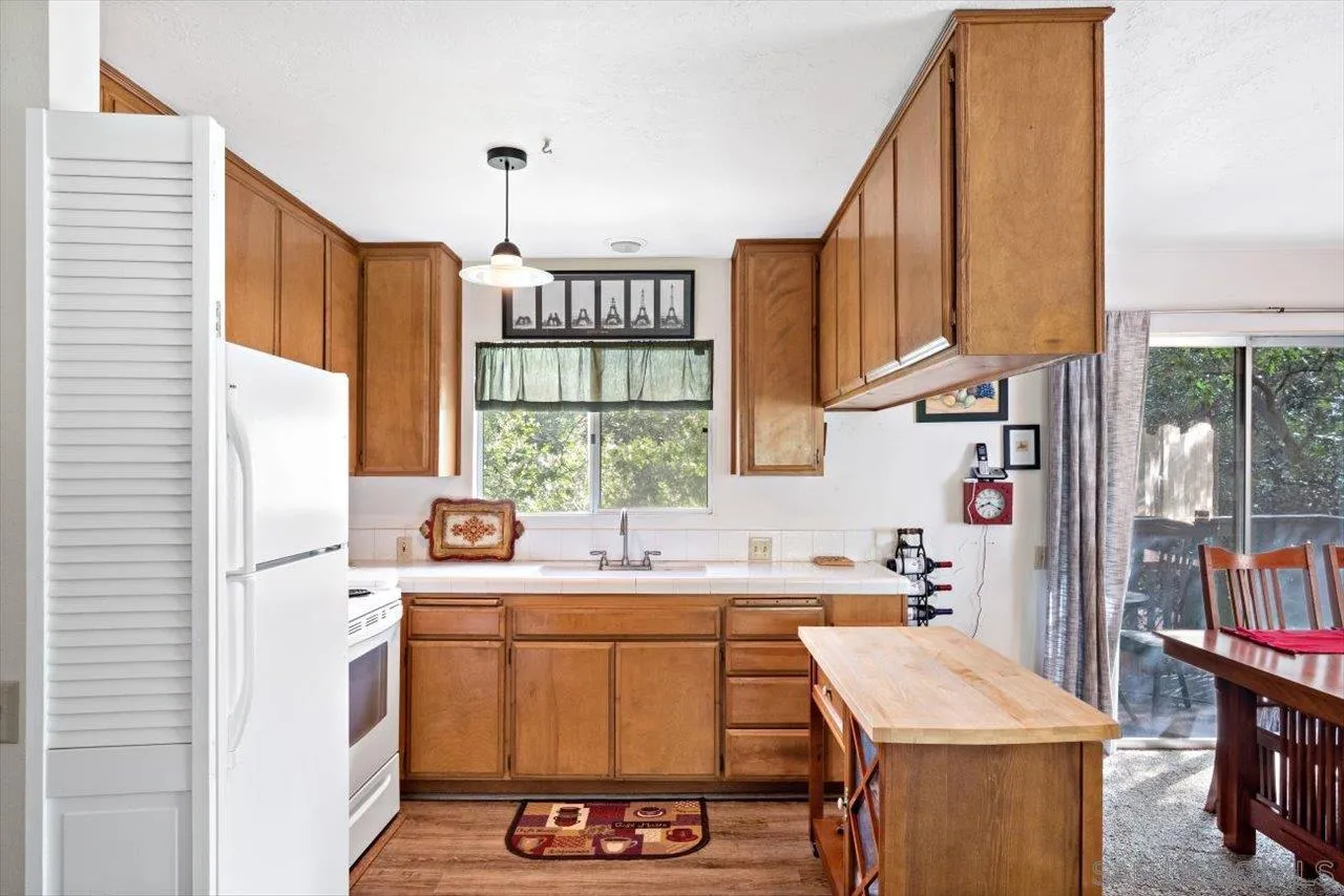 808 Pine Cone Drive Julian, CA 92036 - Photo 12 of 23 a kitchen with a sink stove and cabinets