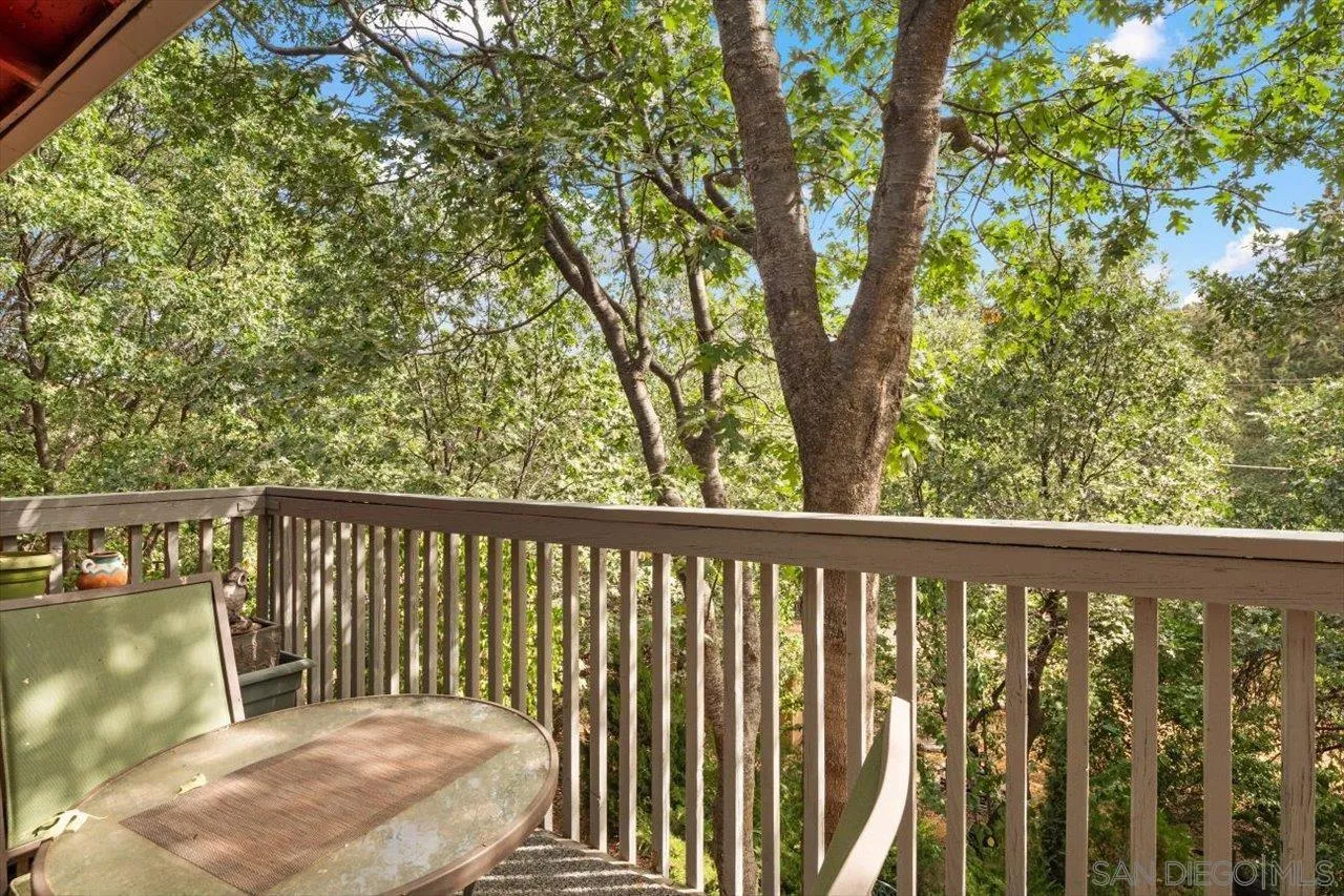 808 Pine Cone Drive Julian, CA 92036 - Photo 16 of 23 a view of balcony with wooden floor and fence