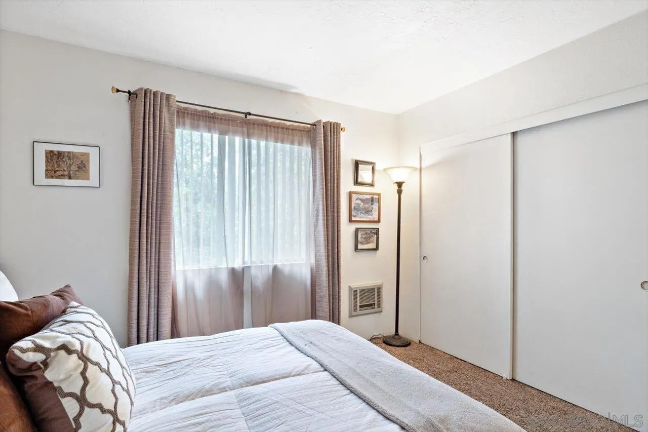 808 Pine Cone Drive Julian, CA 92036 - Photo 18 of 23 a bedroom with a large bed and a window