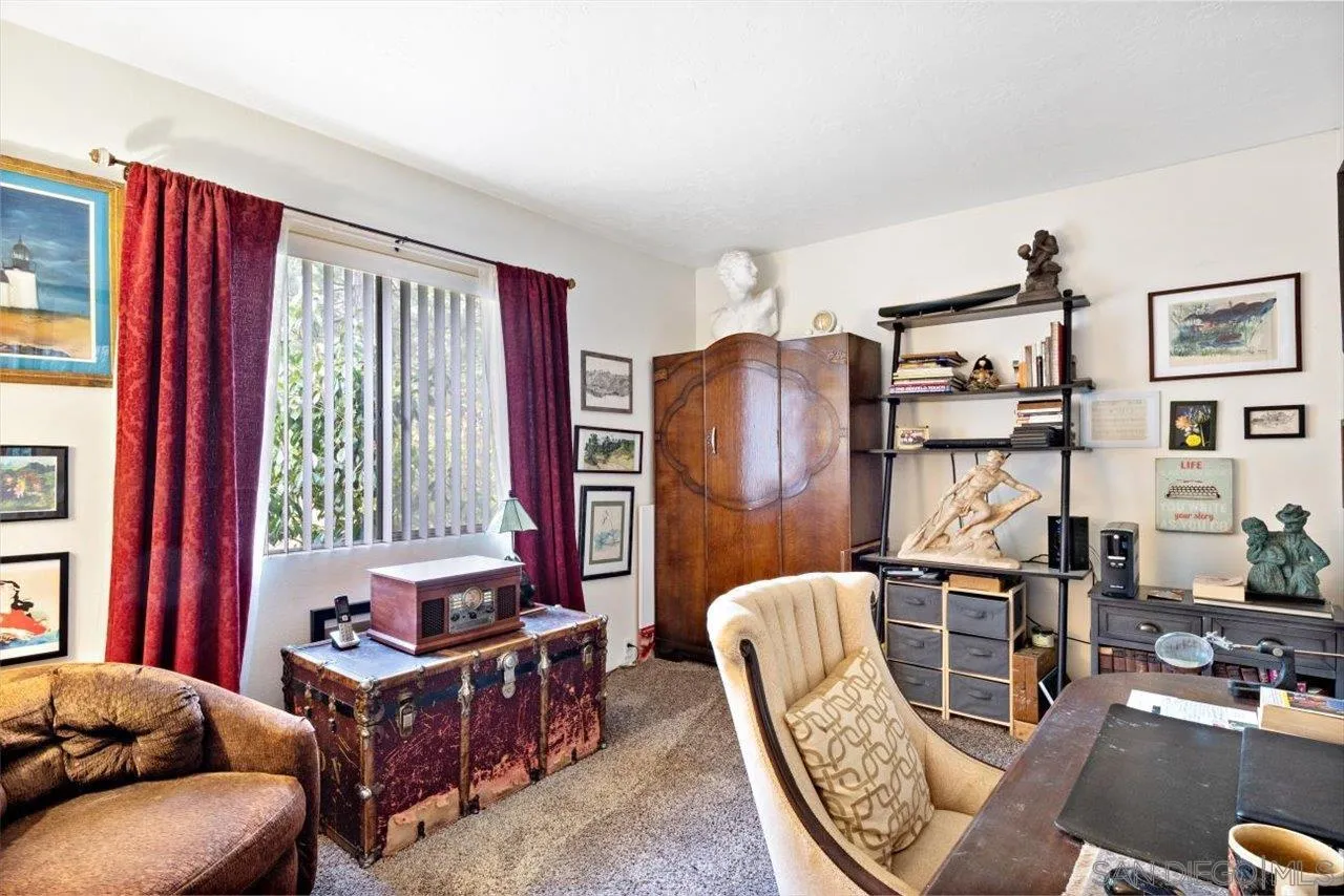808 Pine Cone Drive Julian, CA 92036 - Photo 19 of 23 a living room with furniture a large window and a flat screen tv