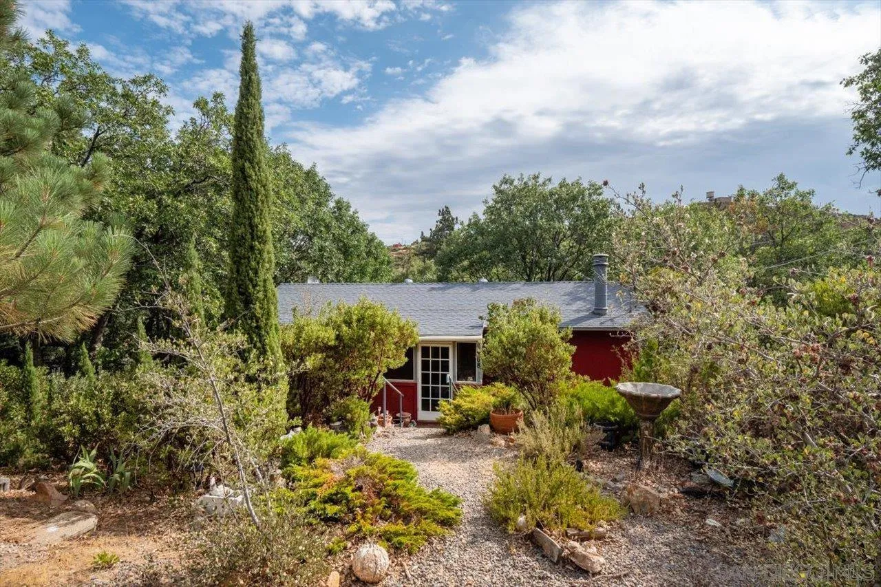 808 Pine Cone Drive Julian, CA 92036 - Photo 4 of 23 a view of a house with a flower garden
