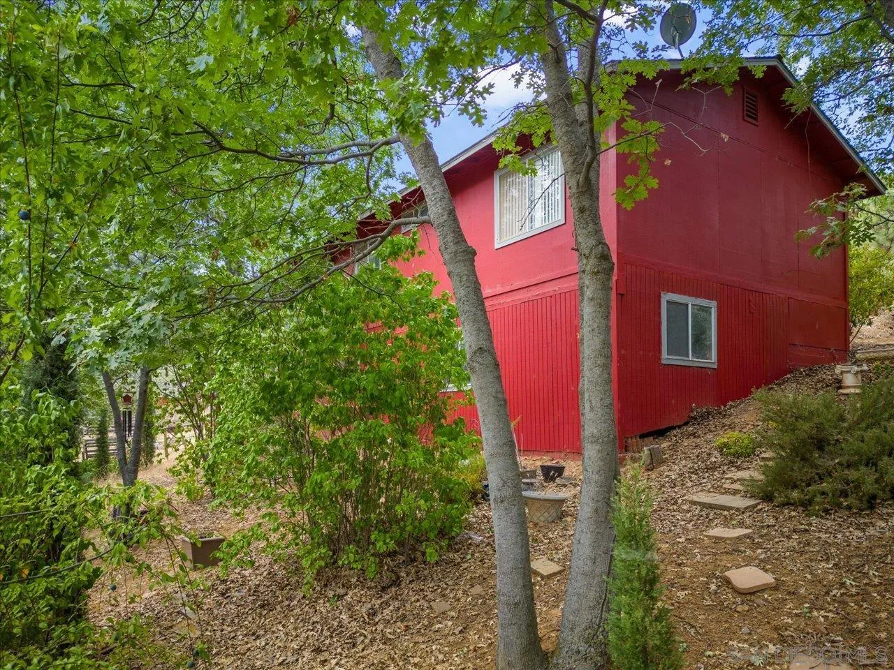 808 Pine Cone Drive Julian, CA 92036 - Photo 6 of 23 a view of a house with a plant