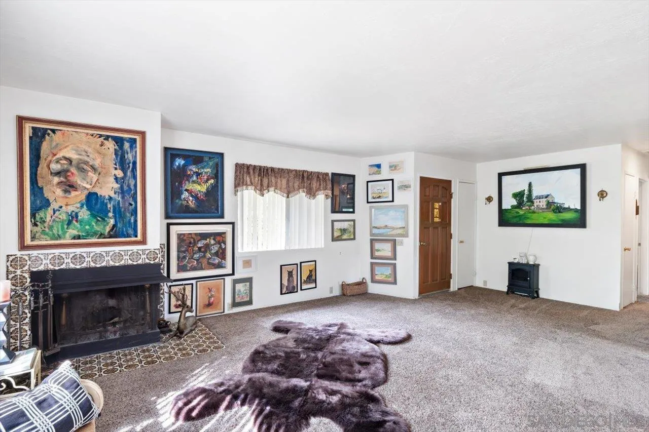 808 Pine Cone Drive Julian, CA 92036 - Photo 9 of 23 a living room with furniture and a fireplace