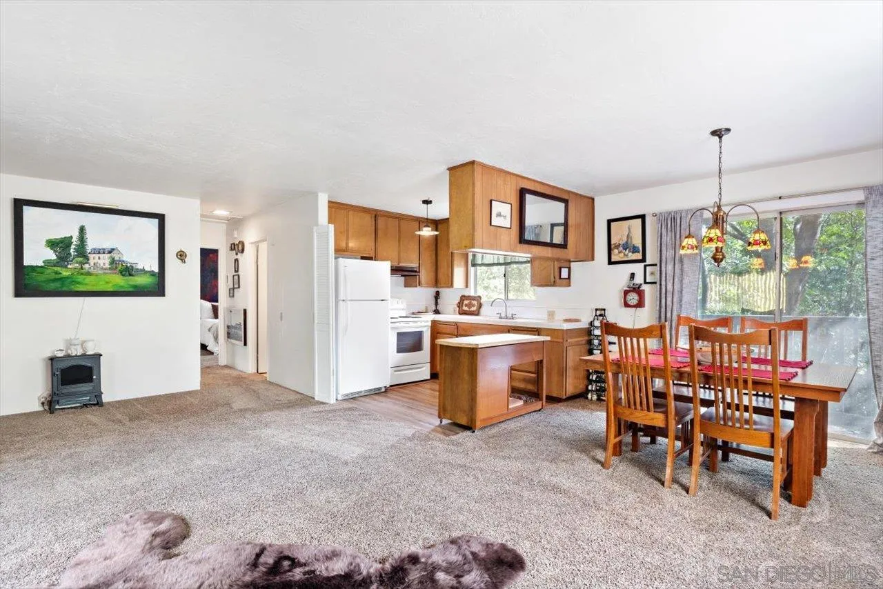 808 Pine Cone Drive Julian, CA 92036 - Photo 10 of 23 a view of a dining room with furniture and window