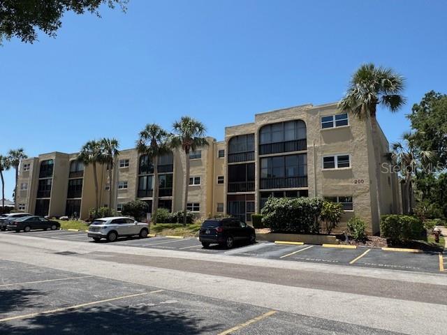 11485 Oakhurst Road, Unit 319 Largo, FL 33774 - Photo 37 of 63 a group of cars parked in front of a building