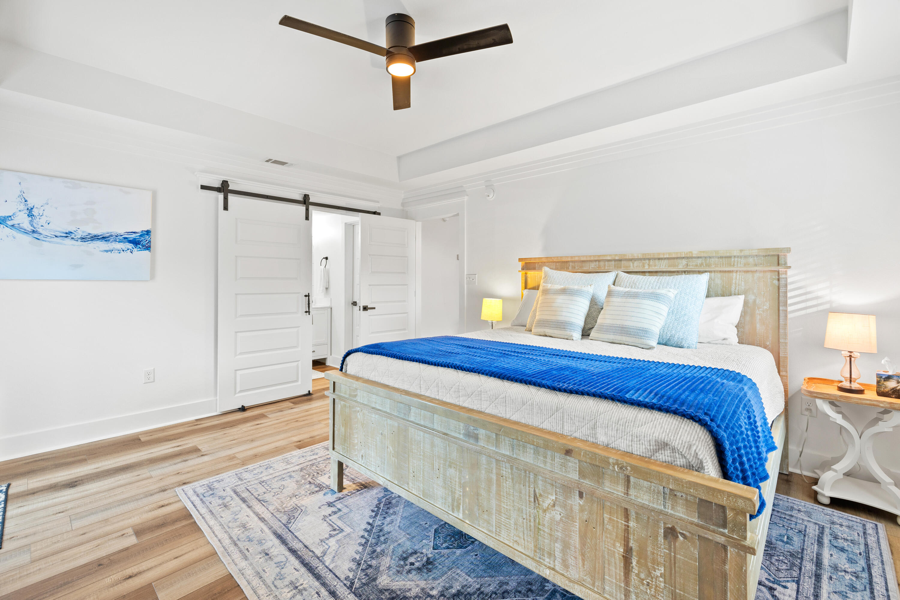65 Brown Street Santa Rosa Beach, FL 32459 - Photo 16 of 43 a bedroom with a bed and wooden floor
