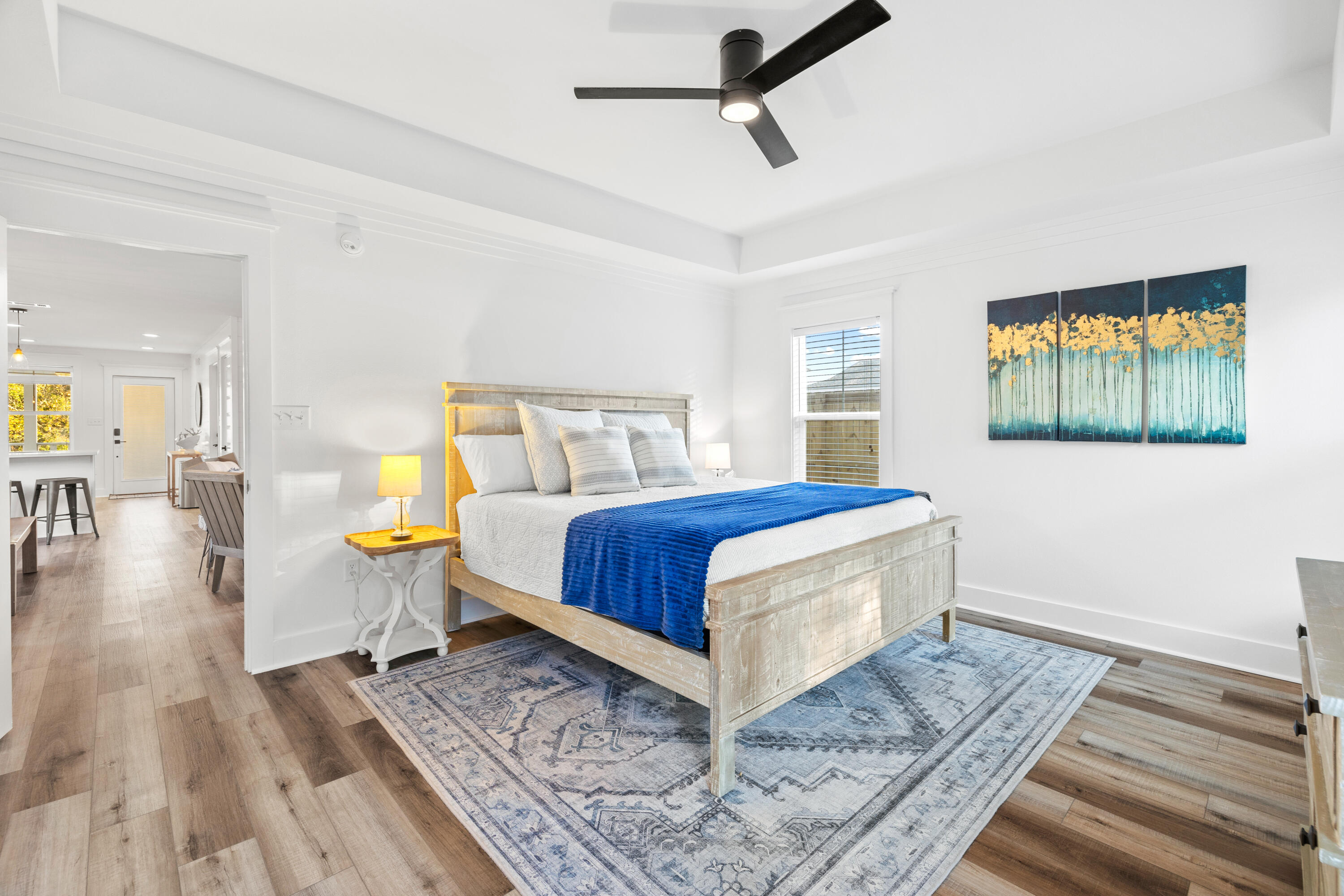 65 Brown Street Santa Rosa Beach, FL 32459 - Photo 17 of 43 a bedroom with a bed and wooden floor