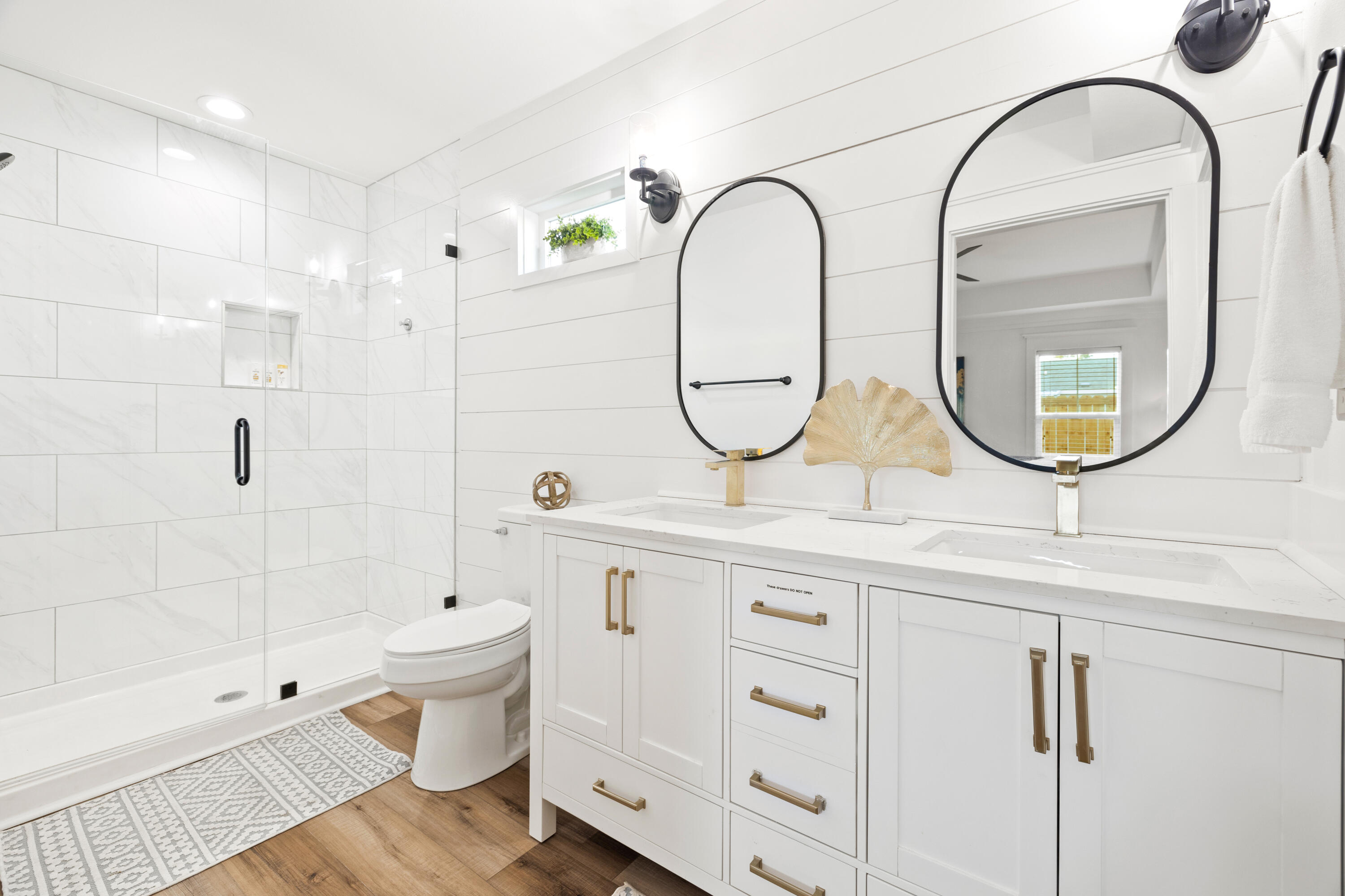 65 Brown Street Santa Rosa Beach, FL 32459 - Photo 23 of 43 a bathroom with a sink a mirror a toilet and a shower
