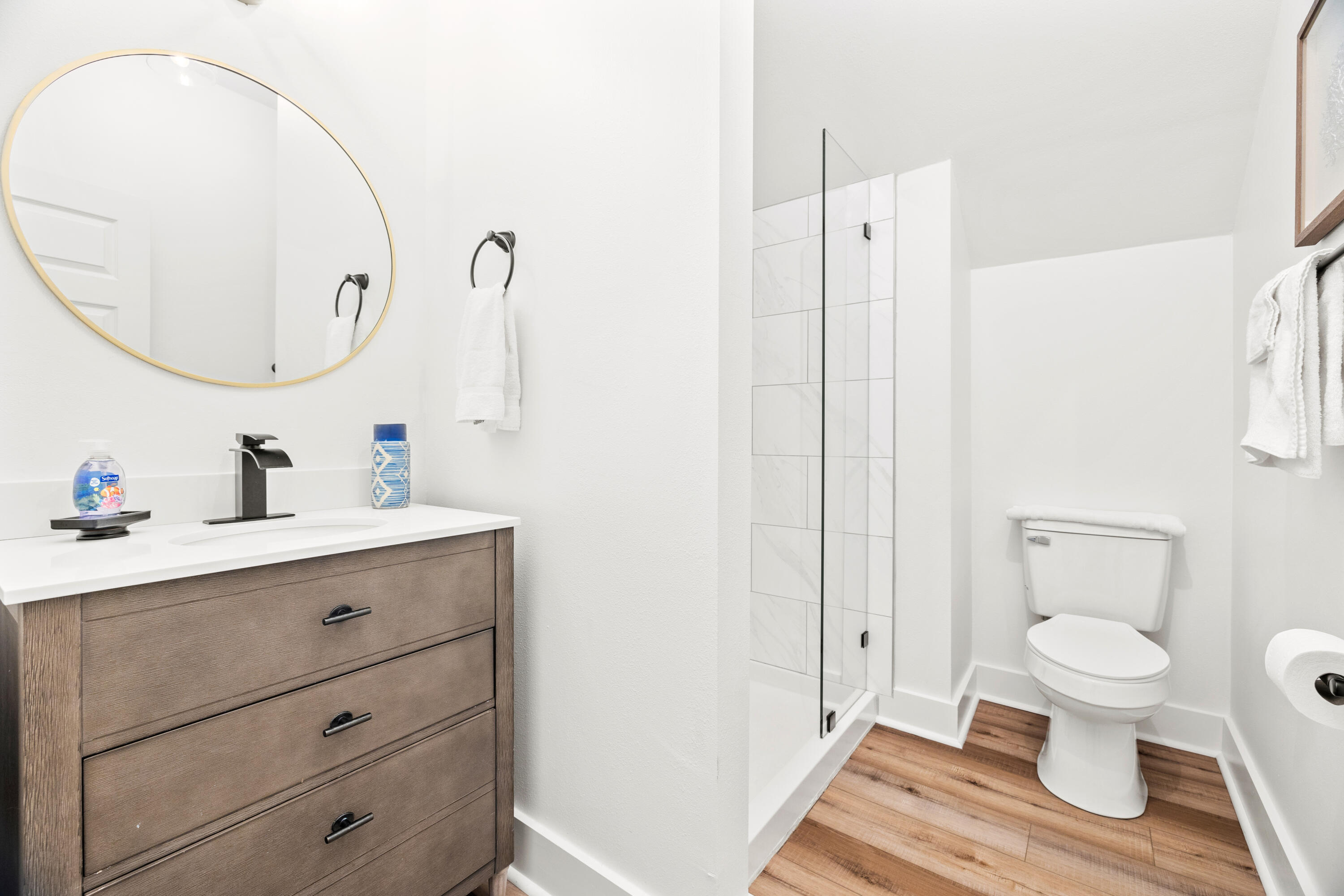 65 Brown Street Santa Rosa Beach, FL 32459 - Photo 26 of 43 a bathroom with a sink a toilet and a mirror